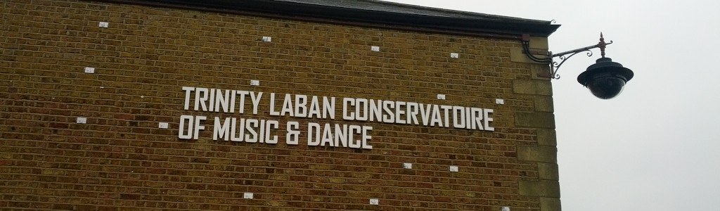 Brick wall with letters that spell “Trinity Laban Conservatoire of Music & Dance”. That location turned out to be an excellent venue.